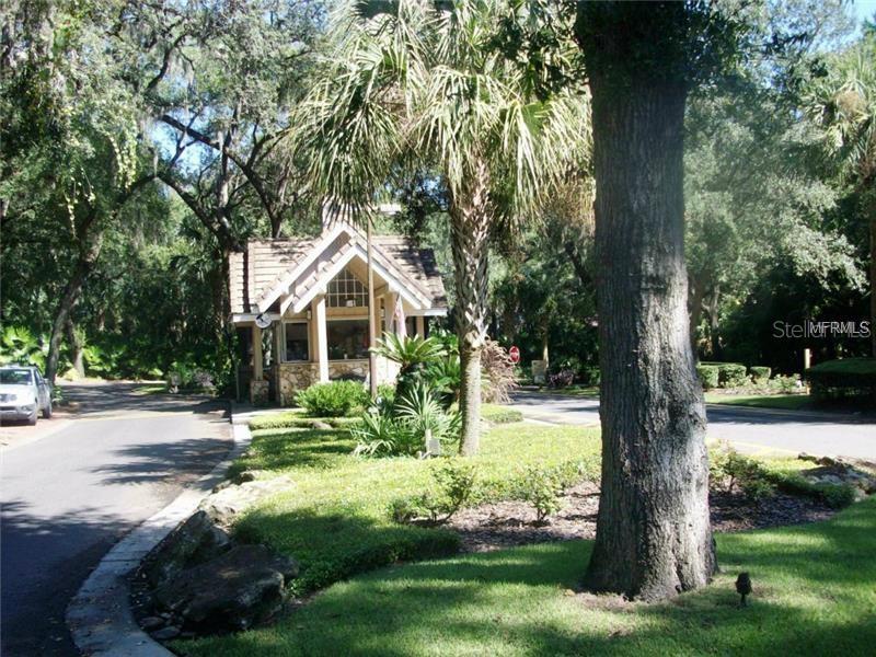 A concrete walkway leads to the front door and garage of a suburban house — 1931 LOST SPRING COURT, LONGWOOD, FL