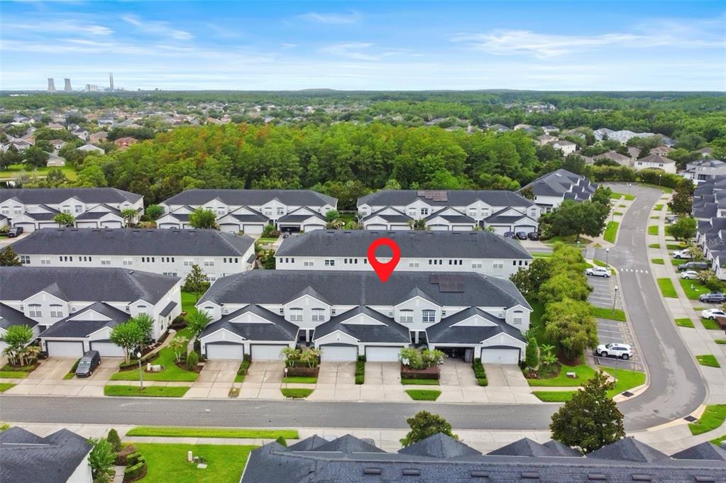 An aerial view shows a row of townhouses with a red pin marking one unit — 1641 SHALLCROSS AVENUE, ORLANDO, FL
