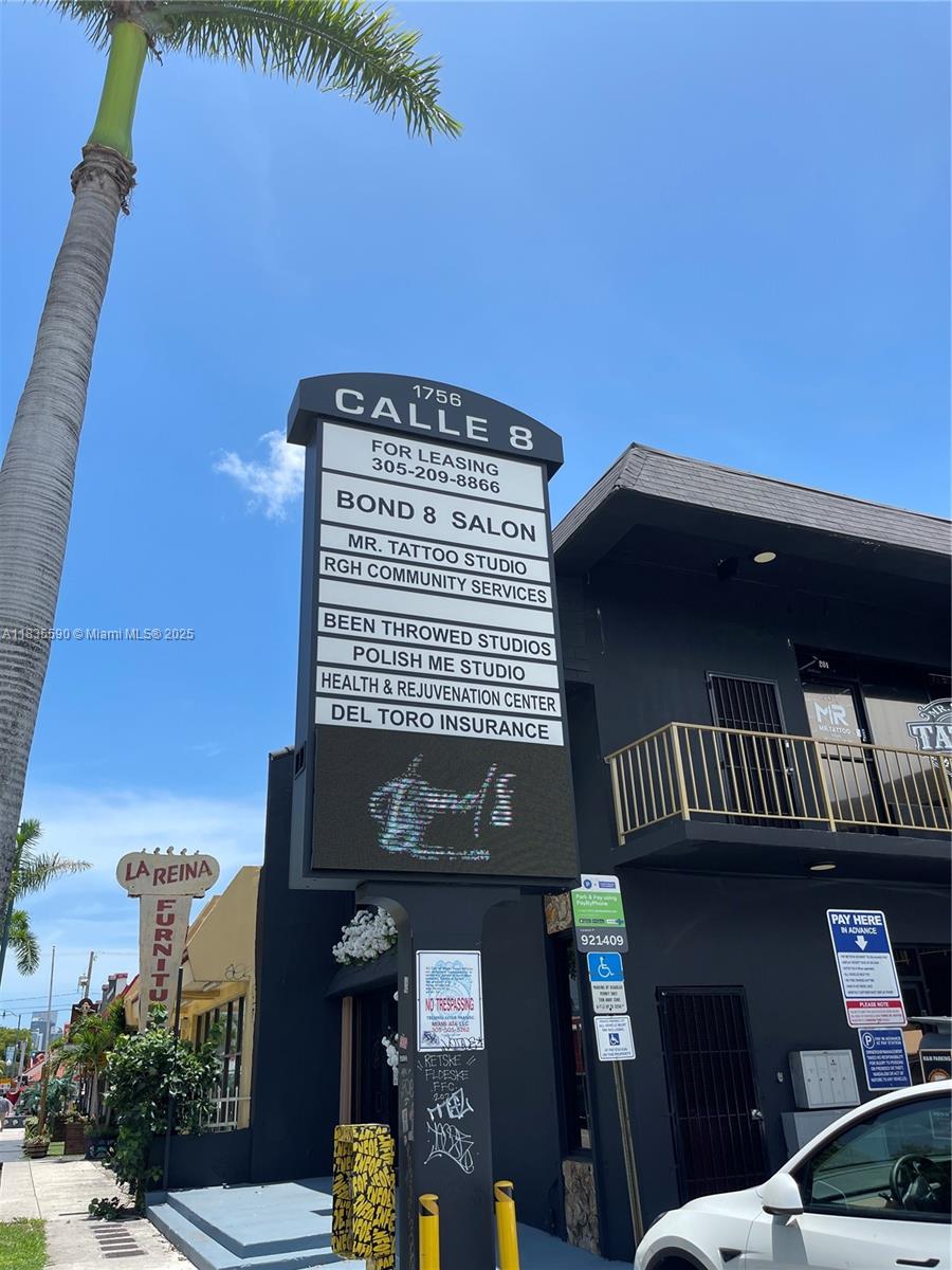 A multi-tenant commercial building sign stands in front of a black two-story building — 1756 SW 8th St # 204, Miami FL 33135, MIAMI, FL