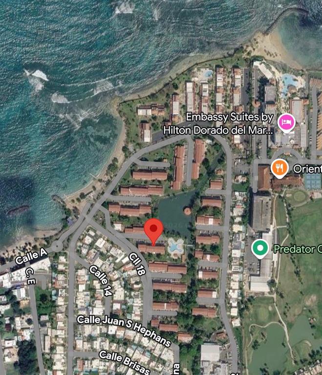 This is an aerial map view of a coastal residential area with a red pin — K5 VILLAS DE PLAYA II UNIT K5, DORADO, PR