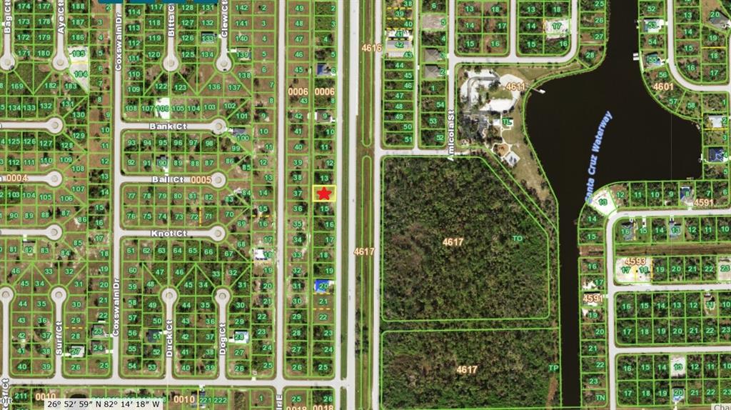 A paved road runs through a grassy area with a car parked on the side — 10225 GASPARILLA ROAD, PLACIDA, FL