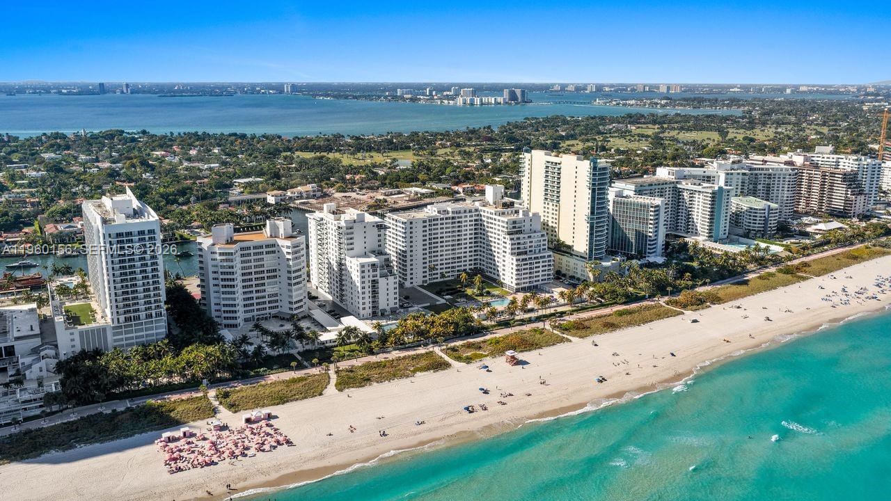 An aerial view of a beachfront condominium complex with a sandy beach and ocean — 5005 Collins Ave # 504, Miami Beach FL 33140, MIAMI BEACH, FL
