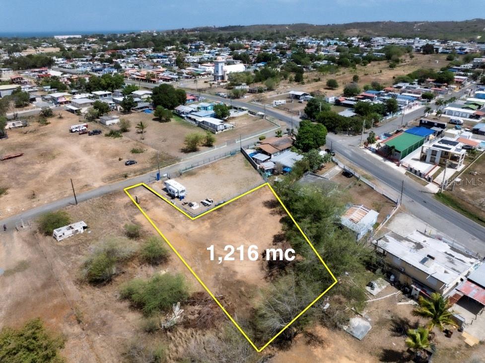 An aerial view shows a vacant, irregularly shaped plot of land outlined in yellow — SR 3301 km 0.5 BO BOQUERON EL COMBATE WARD, CABO ROJO, PR