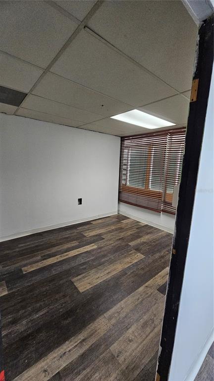 An empty office room features wood-look vinyl flooring, white walls, and a drop ceiling — 167 Plaza Pradera AVE ANTONIO PRINCIPE UNIT 2A, BAYAMON, PR