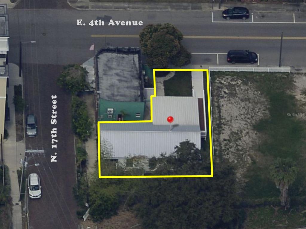 This aerial view shows a building with a metal roof outlined in yellow — 1411 N 17TH STREET, TAMPA, FL