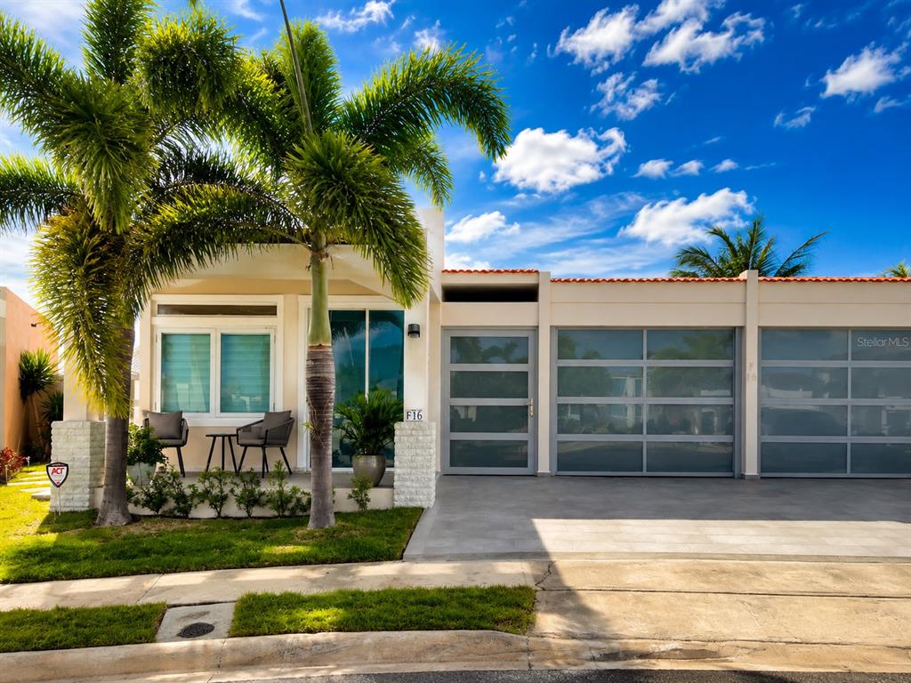 A modern single-story house exterior features a palm tree, a small patio, and a garage — Carr #3 SOLIMAR PATILLAS, PATILLAS, PR
