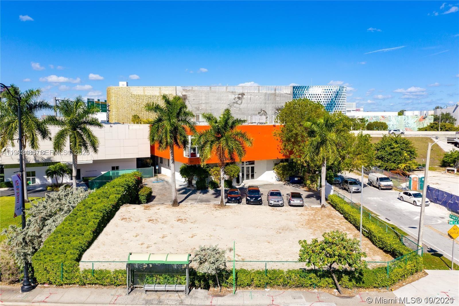 An aerial view shows a vacant lot in front of a building with an orange facade — 3620 NE Miami Pl, Miami FL 33137, MIAMI, FL