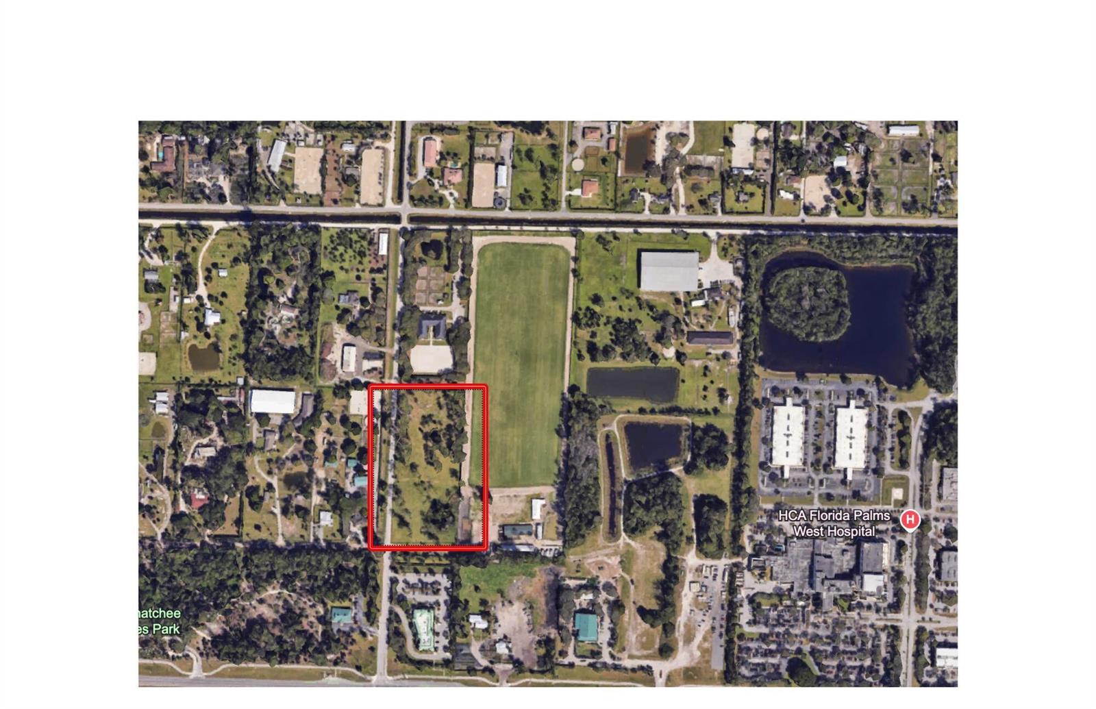 This is an aerial map showing a rectangular property outlined in red near a hospital — 392 F Road, FL 33470, FL