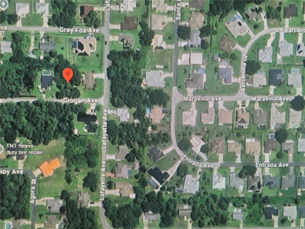 This is an aerial map view of a residential neighborhood with a red location pin — 904 GROGAN AVENUE, SEBRING, FL