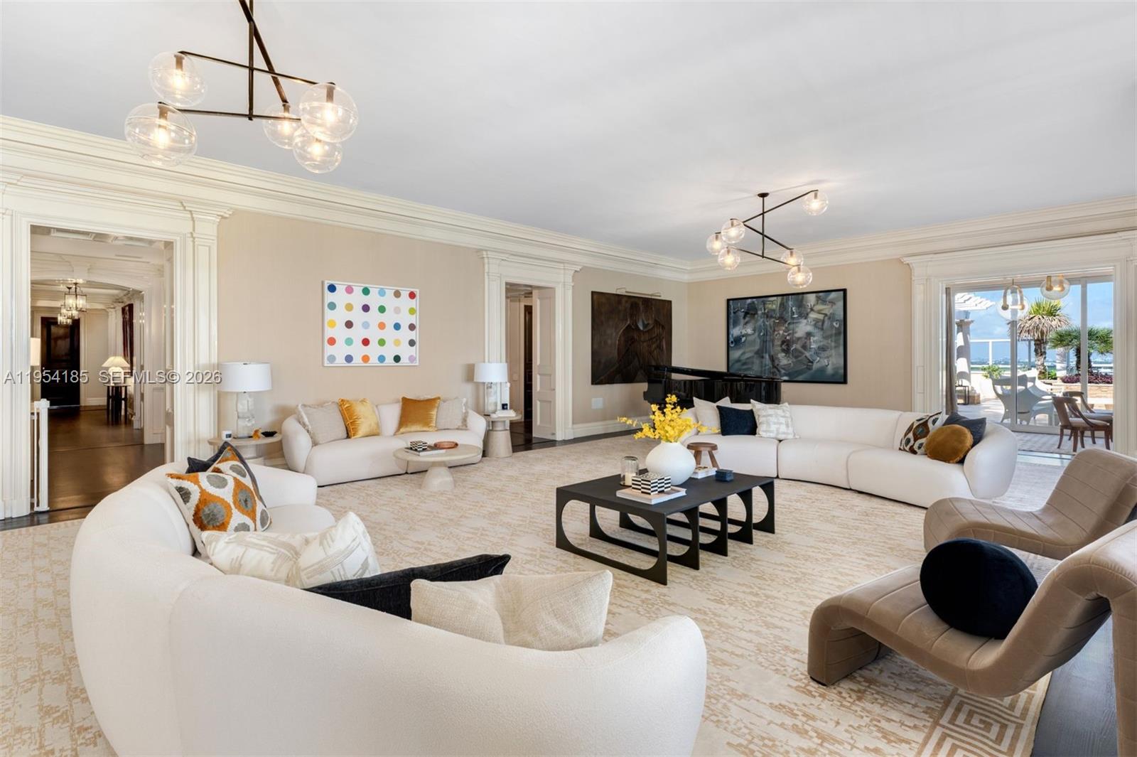A spacious living room features white curved sofas, black coffee tables, and a grand piano — 445 Grand Bay Drive # 1A, Key Biscayne FL 33149, KEY BISCAYNE, FL