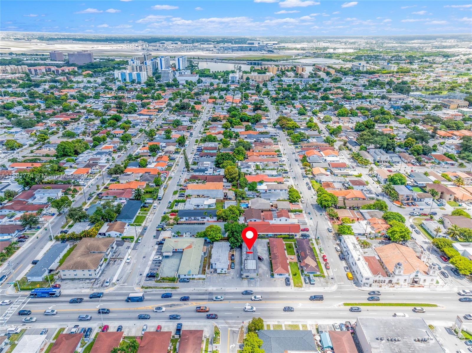 An aerial view shows a commercial building with a red location pin in a neighborhood — 4831 W Flagler St, Miami FL 33134, MIAMI, FL
