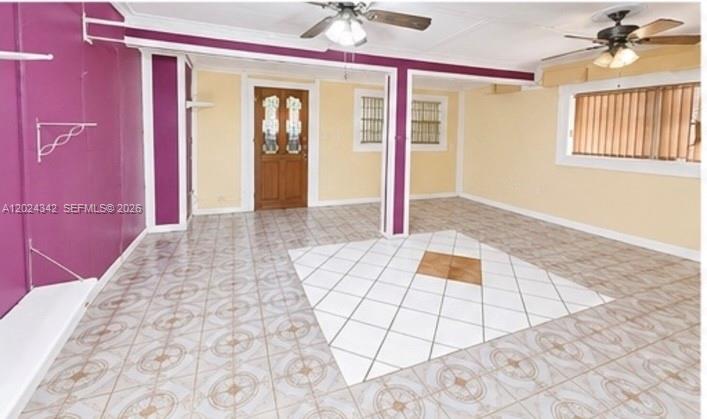 An interior room features purple and yellow walls, tiled flooring, and two ceiling fans — 6225 SW 59th St, South Miami FL 33143, SOUTH MIAMI, FL