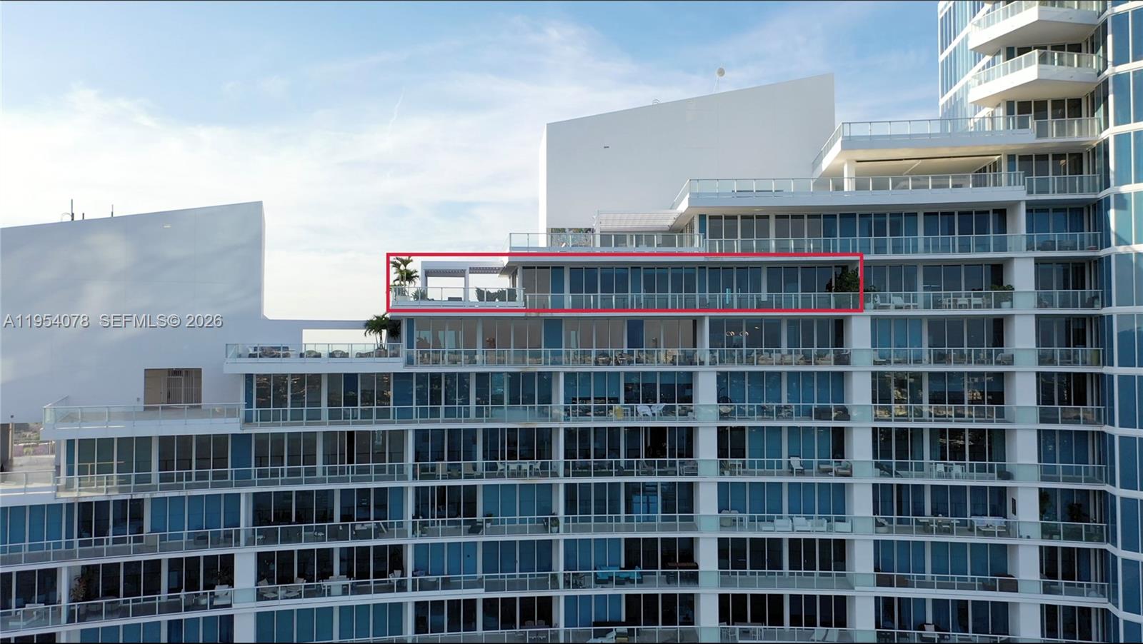 An exterior view of a high-rise building featuring a large terrace with a pergola — 2020 N Bayshore Dr # 4104, Miami FL 33137, MIAMI, FL