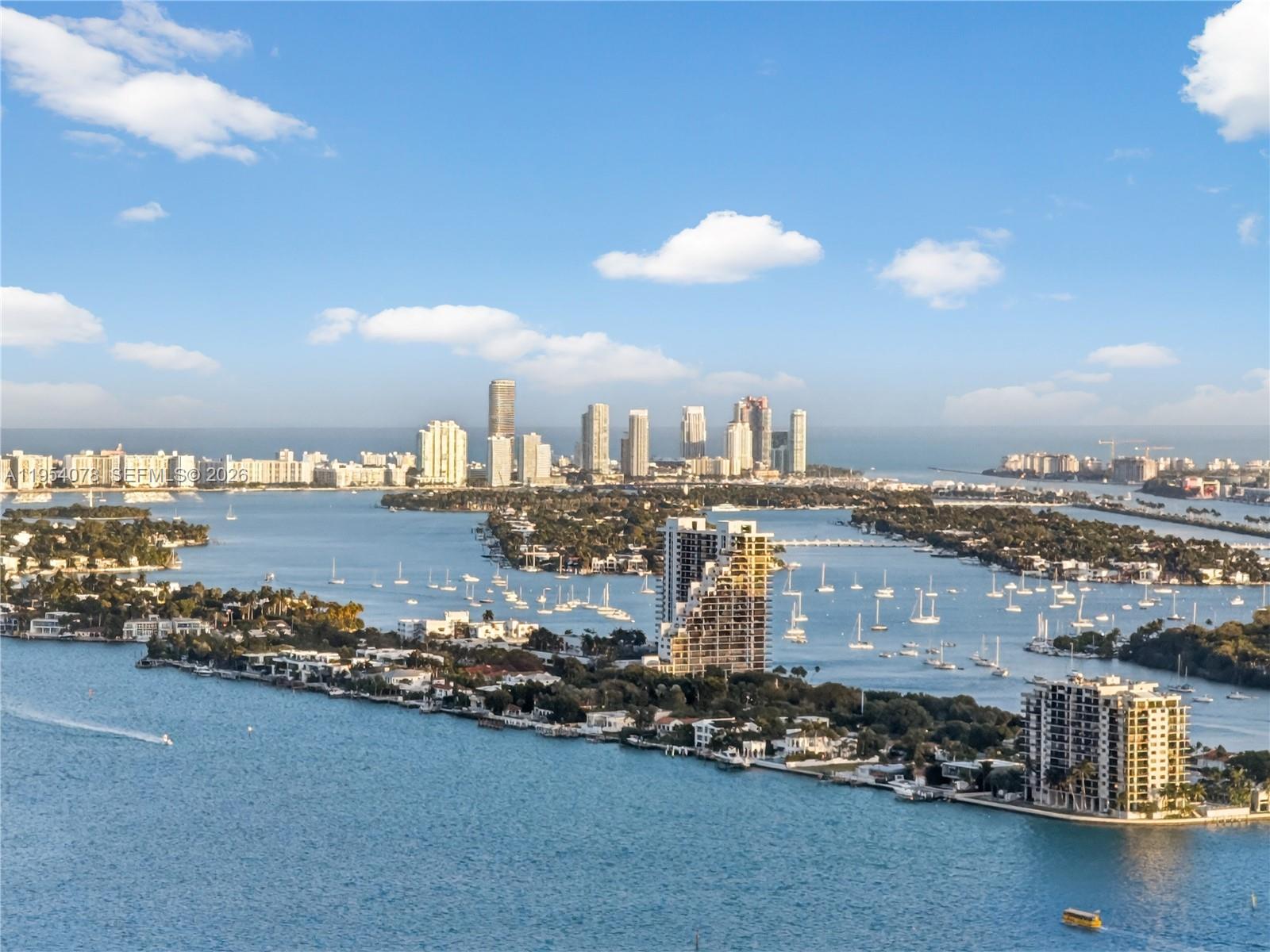 An aerial view of a coastal city skyline with islands, boats, and high-rise buildings — 2020 N Bayshore Dr # 4104, Miami FL 33137, MIAMI, FL