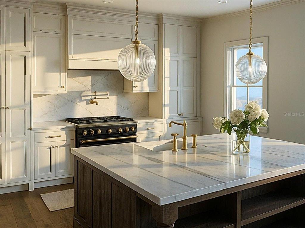 A kitchen features white cabinetry, a dark wood island, marble countertops, and two glass pendants — 149 W WILBUR AVENUE UNIT 101, LAKE MARY, FL