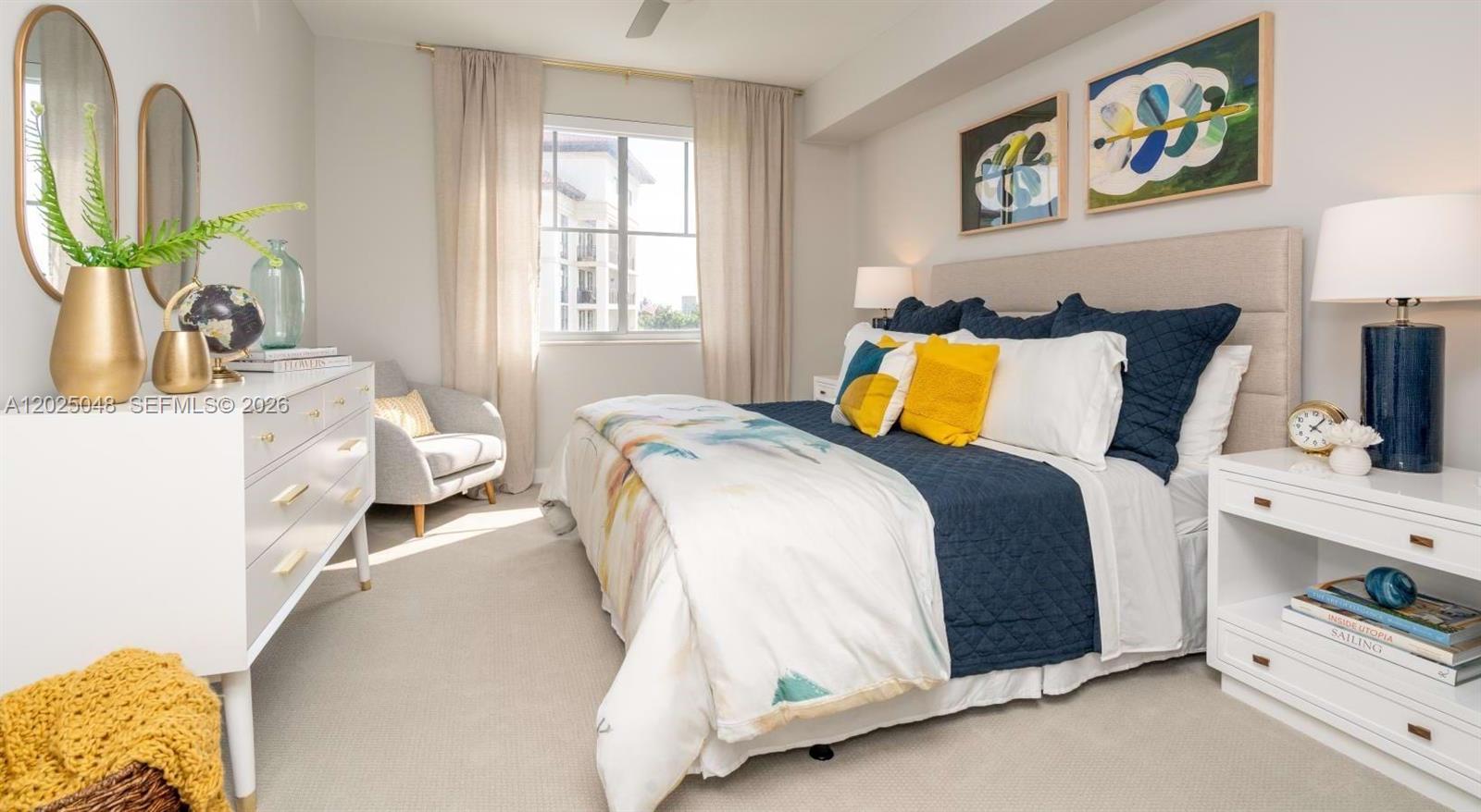 A bedroom features a bed with blue and yellow bedding, white furniture, and two mirrors — 4720 NW 85th Ave, Doral FL 33166, DORAL, FL