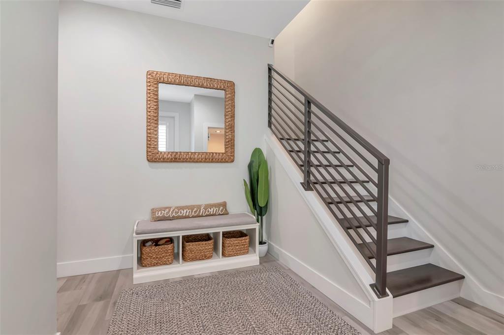 A covered outdoor patio features lounge seating, a dining set, and a built-in grill — 536 4TH AVENUE S UNIT 2, ST PETERSBURG, FL