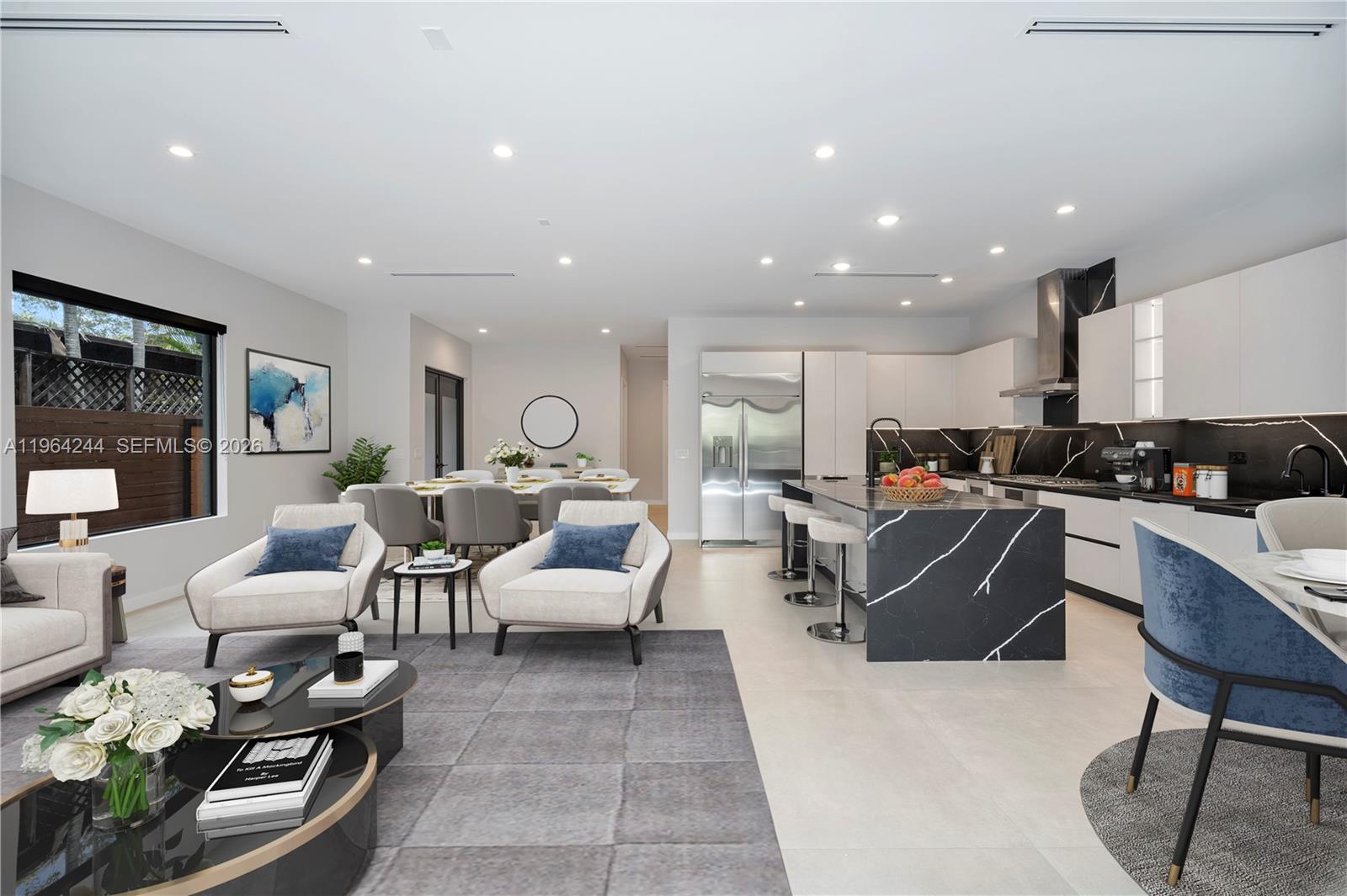 An open-concept living area features a modern kitchen with a black marble island and dining space — 2962 W Trade Ave, Coconut Grove FL 33133, COCONUT GROVE, FL