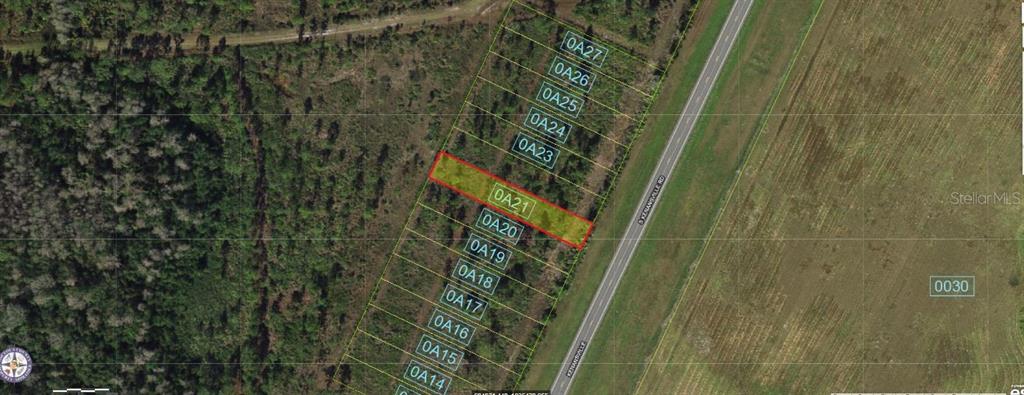 This aerial map shows a highlighted rectangular land parcel bordering a paved road — S KENANSVILLE ROAD, OKEECHOBEE, FL