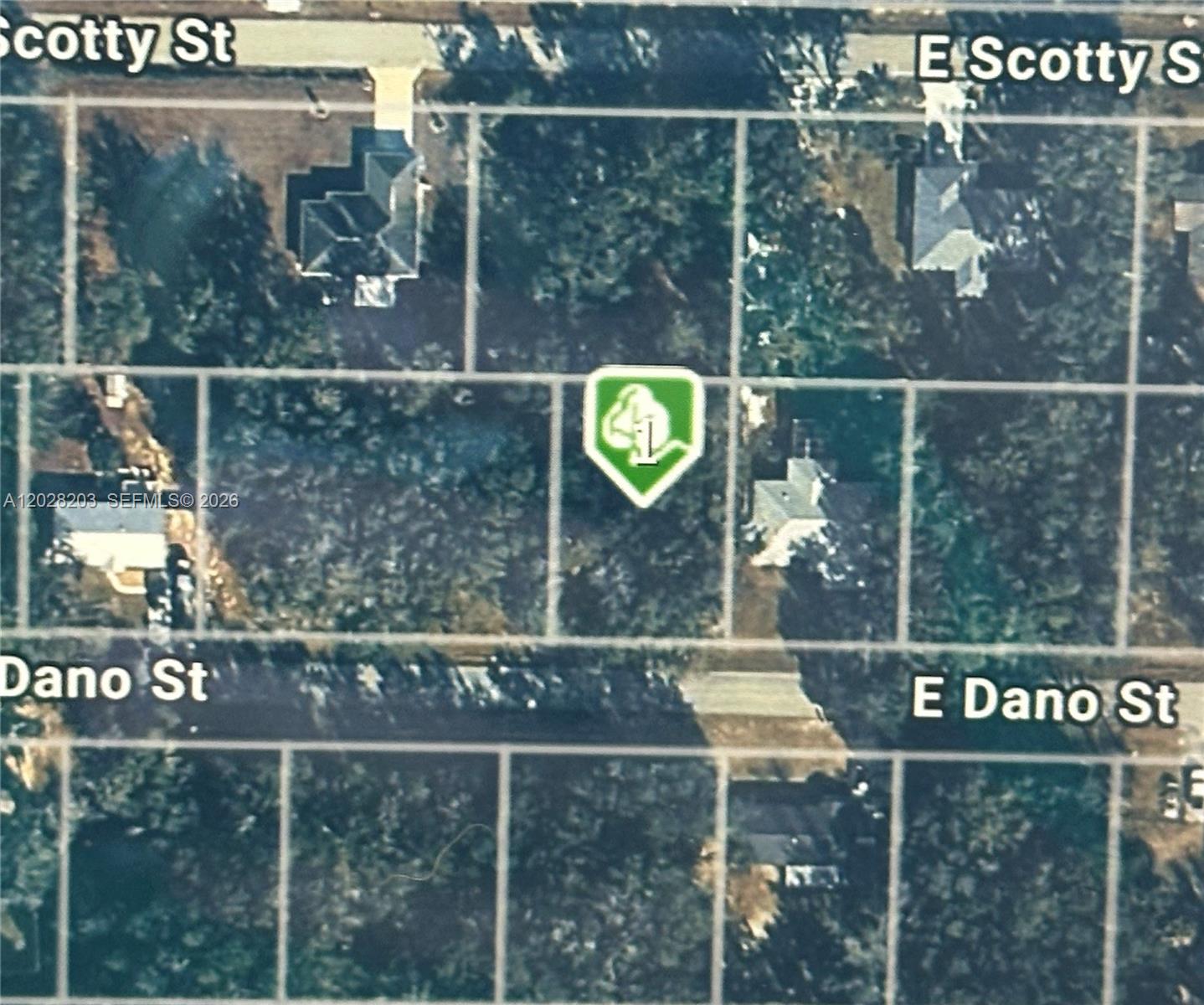 This is an aerial map showing a vacant lot marked with a green icon — 4043 E Dano, Inverness FL 34453, INVERNESS, FL