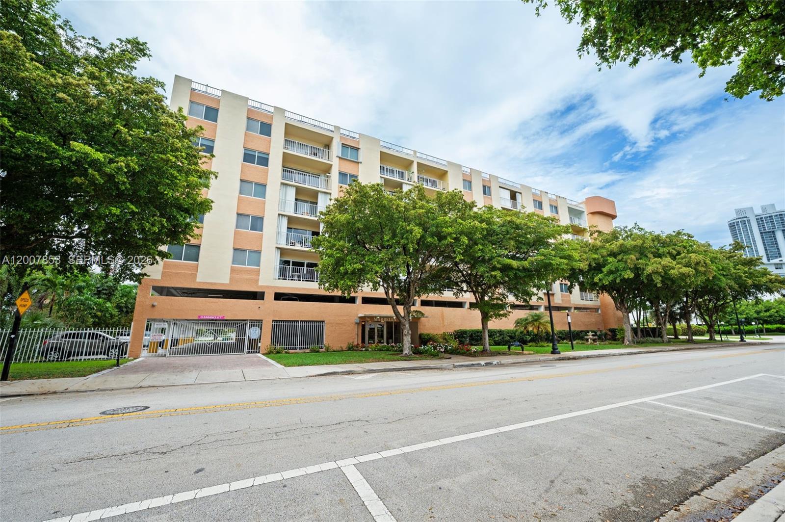 A multi-story apartment building with balconies and a ground-level parking garage entrance — 200 178th Dr # 505, Sunny Isles Beach FL 33160, SUNNY ISLES BEACH, FL
