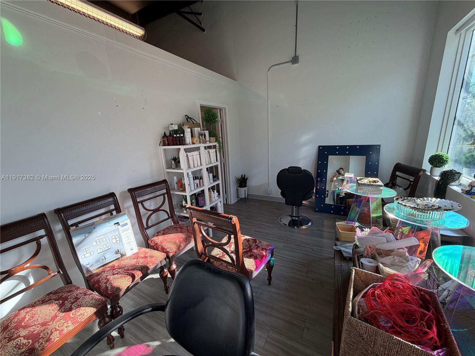 A salon room features a styling chair, a large mirror, and several chairs for seating — 2201 Palm Ave, Miramar FL 33025, MIRAMAR, FL