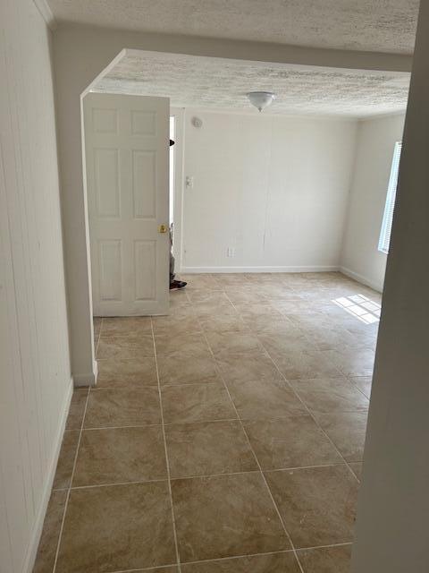 A room with light-colored walls, a white door, and tan tiled flooring — 1400 Hernando Drive, Tallahassee FL 32304, TALLAHASSEE, FL