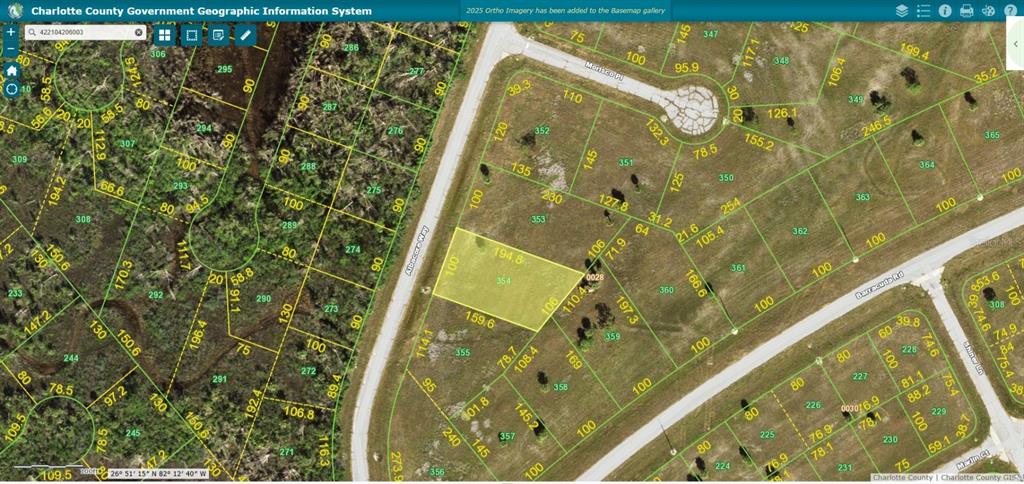 This is a GIS map showing a highlighted vacant residential lot with property boundary lines — 12100 ALBACORE WAY, PLACIDA, FL