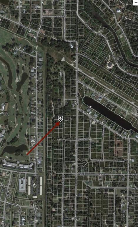 This is an aerial map showing a vacant lot marked with a pin — 1445 HIGHLANDS ROAD, PUNTA GORDA, FL