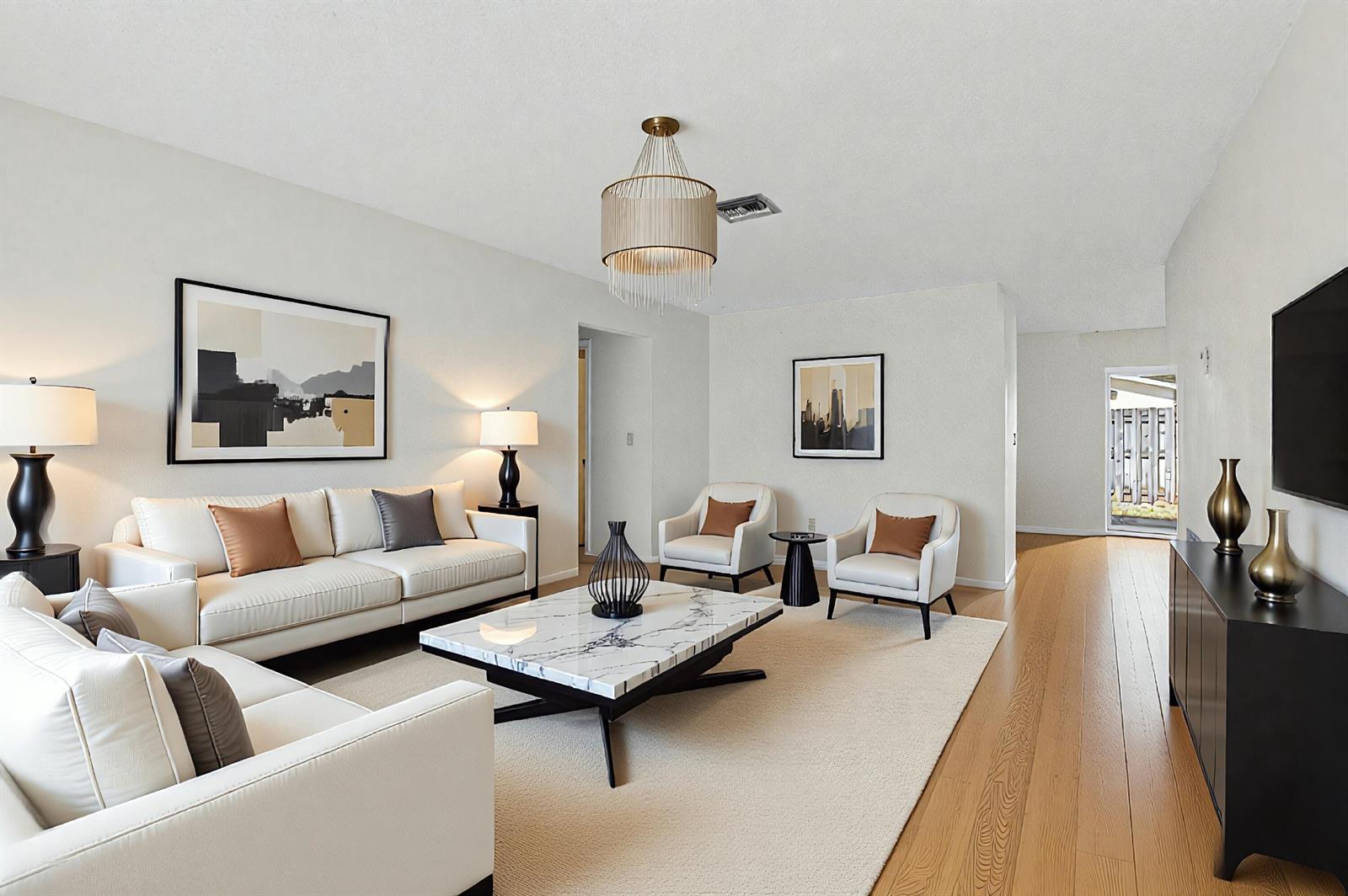 A living room features white sofas, a marble coffee table, and light wood flooring — 1601 NW 5th Street, Boca Raton FL 33486, BOCA RATON, FL