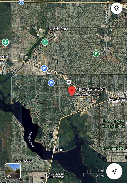 This is a satellite map view showing the location of a property in Florida — 1099 MADEIRA STREET, PORT CHARLOTTE, FL