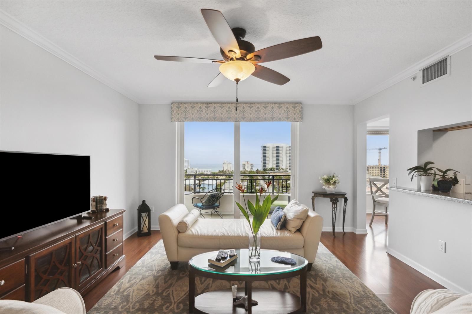 A living room features a daybed, glass coffee table, and a balcony with ocean views — 2880 NE 14th St Causeway # 904, Pompano Beach FL 33062, POMPANO BEACH, FL