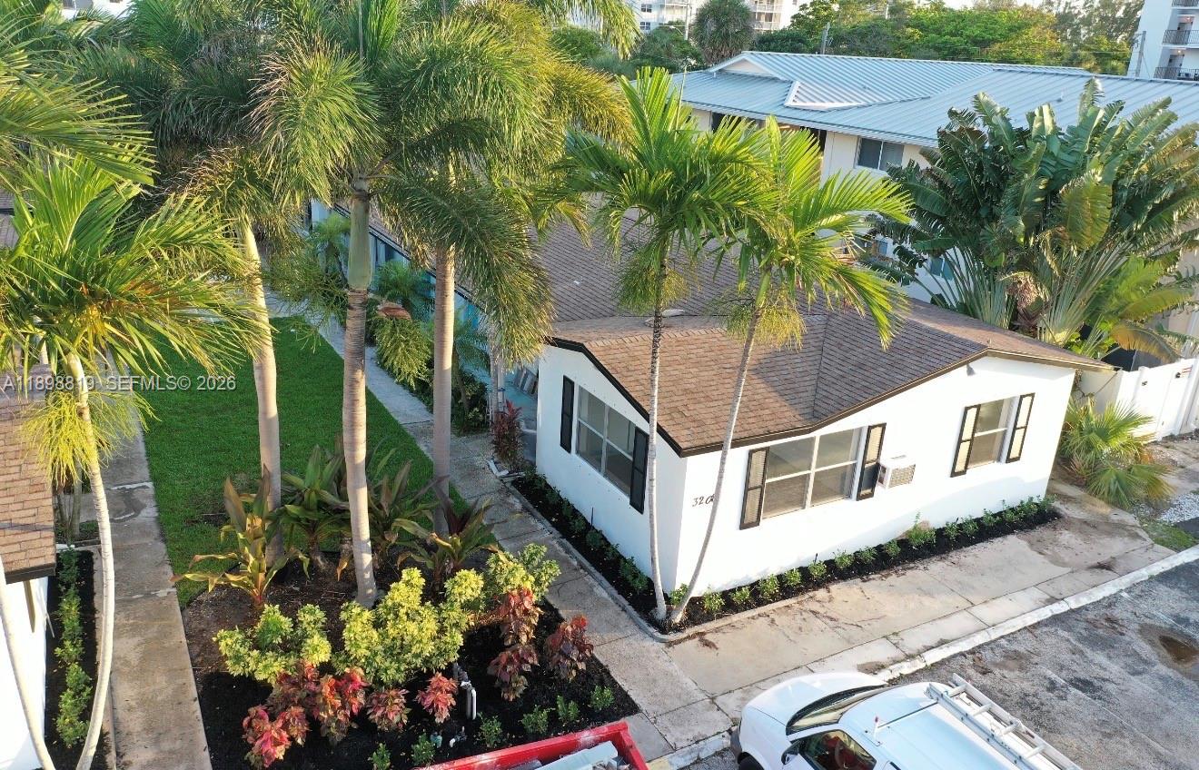 An aerial view shows a white single-story house with a brown roof and palm trees — 3208 Canal Dr # 4, Pompano Beach FL 33062, POMPANO BEACH, FL