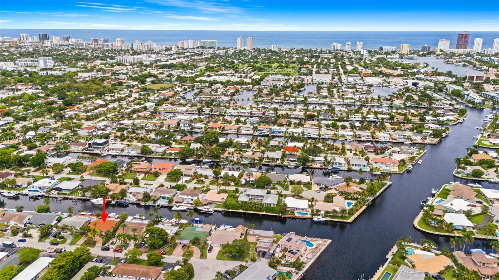 An aerial view shows a residential neighborhood with houses along canals leading to the ocean — 370 SE 12th Ave, Pompano Beach FL 33060, POMPANO BEACH, FL