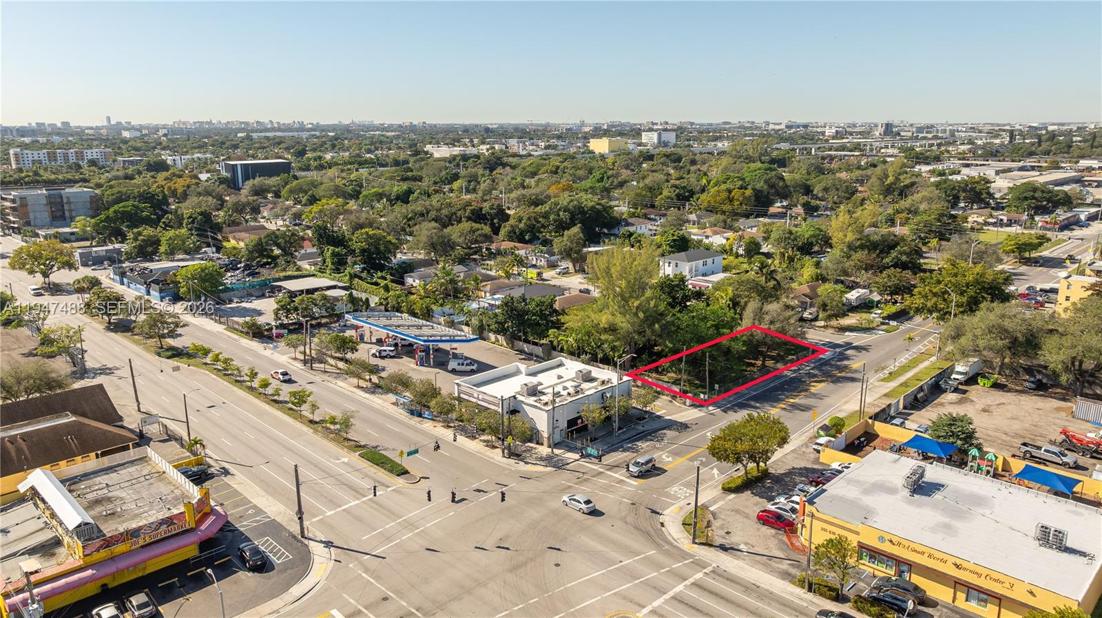An aerial view shows a vacant, rectangular lot outlined in red near a street intersection — 2226 NW 46th St, Miami FL 33142, MIAMI, FL