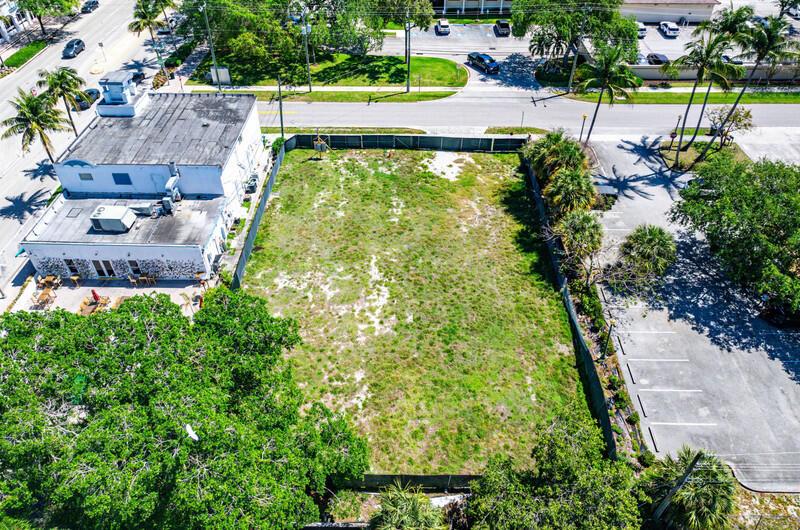 An aerial view shows a vacant rectangular lot situated between a building and a parking area — 10 SW 4th Avenue, Delray Beach FL 33444, DELRAY BEACH, FL