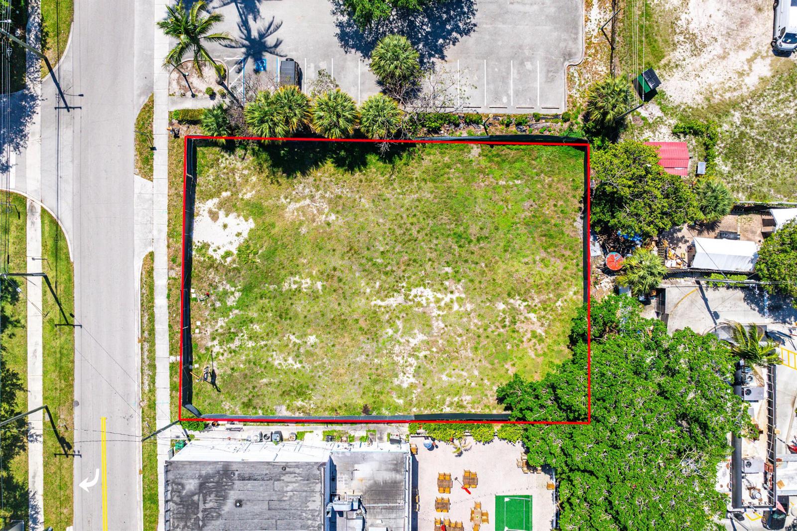 An aerial view shows a rectangular, fenced-in vacant lot bordered by a road and buildings — 10 SW 4th Avenue, Delray Beach FL 33444, DELRAY BEACH, FL