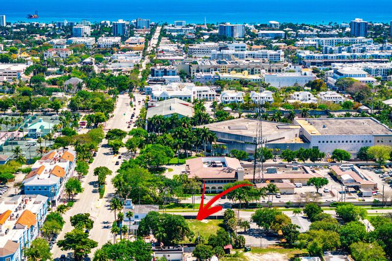 An aerial view shows a vacant lot marked with a red arrow near urban buildings — 10 SW 4th Avenue, Delray Beach FL 33444, DELRAY BEACH, FL