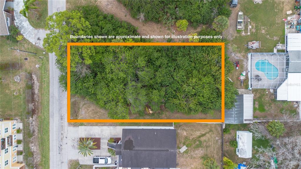 An aerial view shows a rectangular, tree-covered vacant lot outlined in orange — 6317 OELSNER STREET, NEW PORT RICHEY, FL