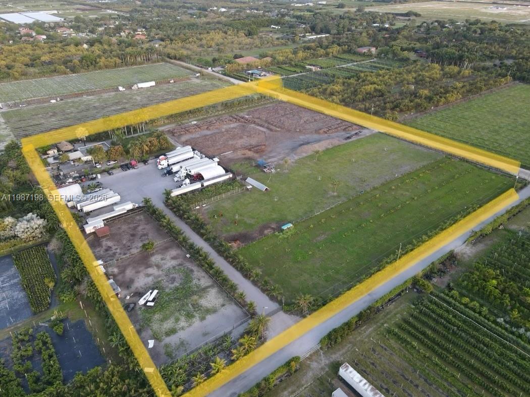 An aerial view shows a large, fenced rectangular lot containing trucks, buildings, and open land — 17325 SW 188th St, Miami FL 33187, MIAMI, FL