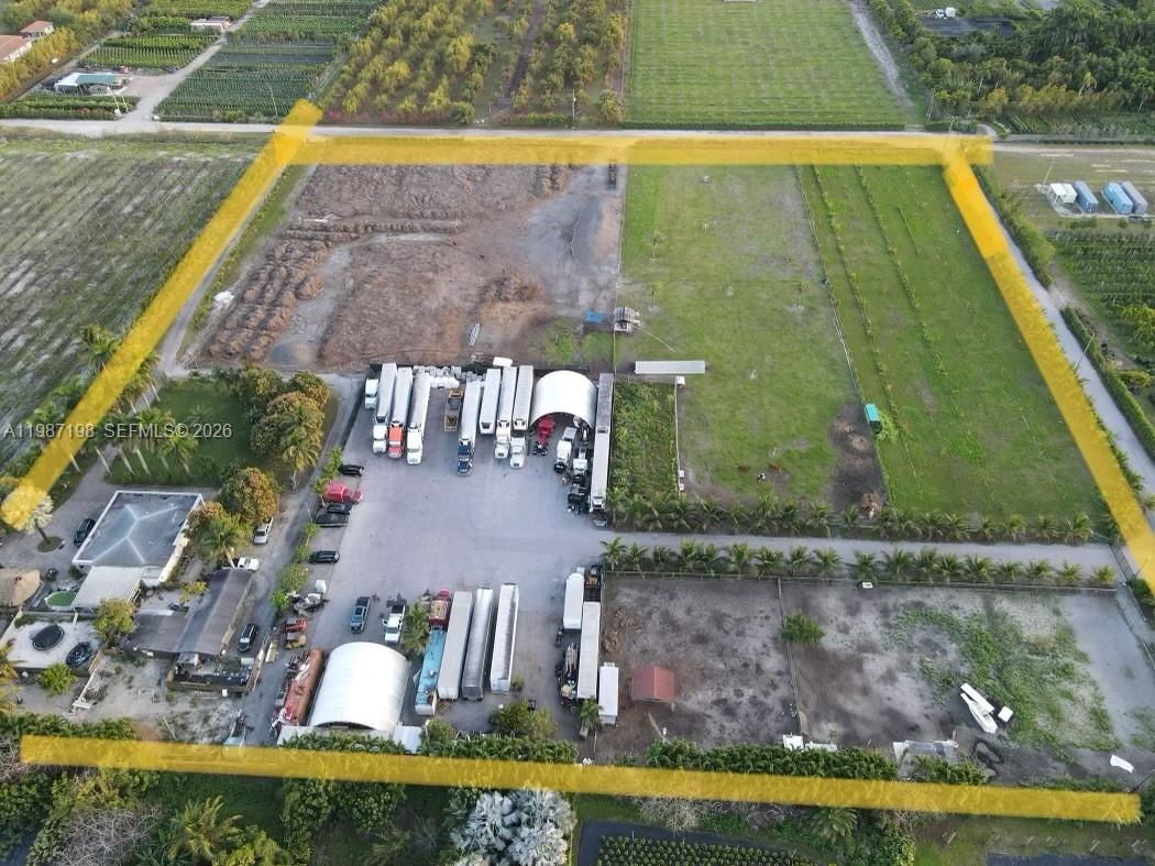 An aerial view shows a large rectangular lot with a parking area, trucks, and structures — 17325 SW 188th St, Miami FL 33187, MIAMI, FL