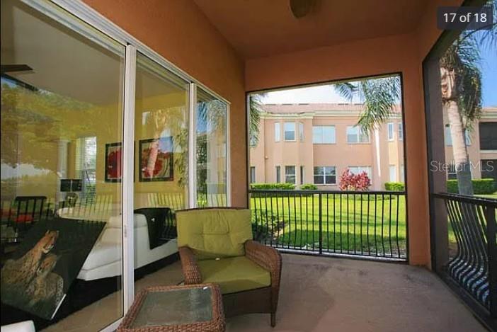 A two-story peach-colored townhouse with a white garage door and a concrete walkway — 5514 46TH COURT W, BRADENTON, FL