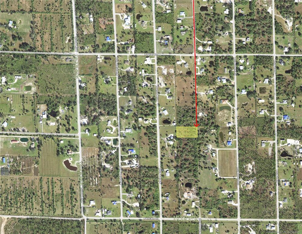 This is an aerial map showing a highlighted rectangular plot of land in a residential area — 6389 ALFRED BOULEVARD, PUNTA GORDA, FL