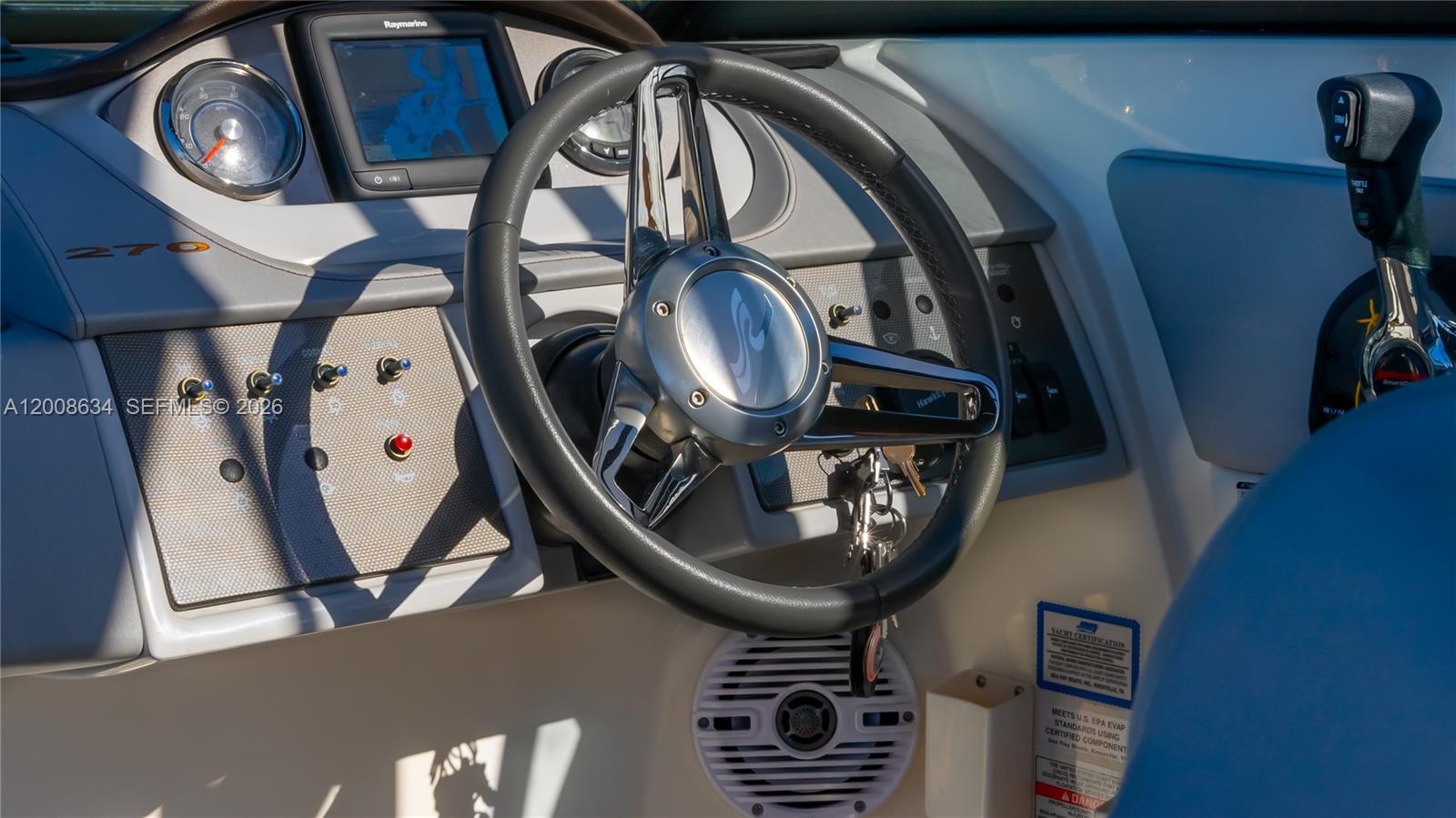 The interior view shows the helm station of a boat with a steering wheel and controls — 910 West Ave, Miami Beach FL 33139, MIAMI BEACH, FL