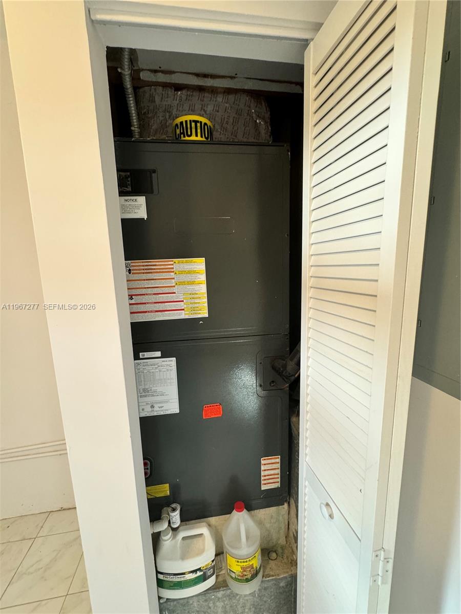 An HVAC air handler unit is installed inside a small utility closet — 4381 Purdy Ln, West Palm Beach FL 33406, WEST PALM BEACH, FL