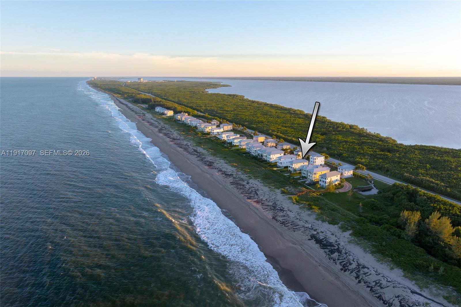 An aerial view shows a row of beachfront houses along a narrow coastal strip — 4824 Watersong Way, Fort Pierce FL 34949, FORT PIERCE, FL