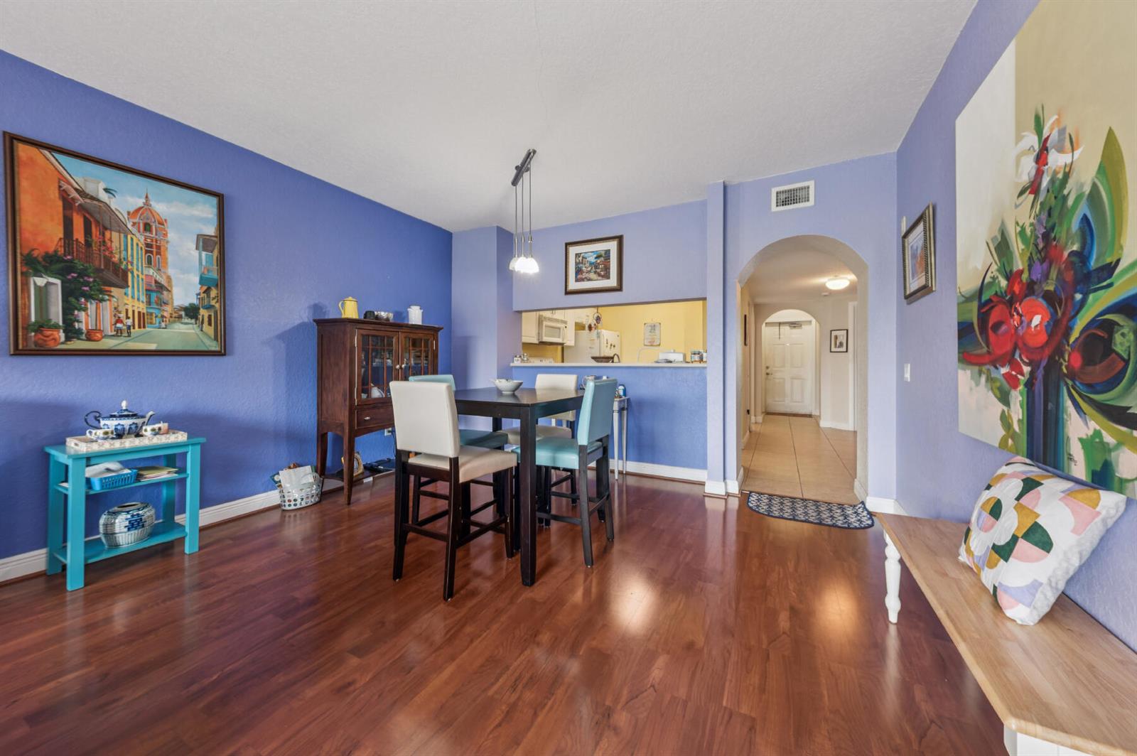 A dining room with hardwood floors, blue walls, a dark wood hutch, and a table — 4721 E Lucerne Lakes Blvd E # 744, Lake Worth FL 33467, LAKE WORTH, FL