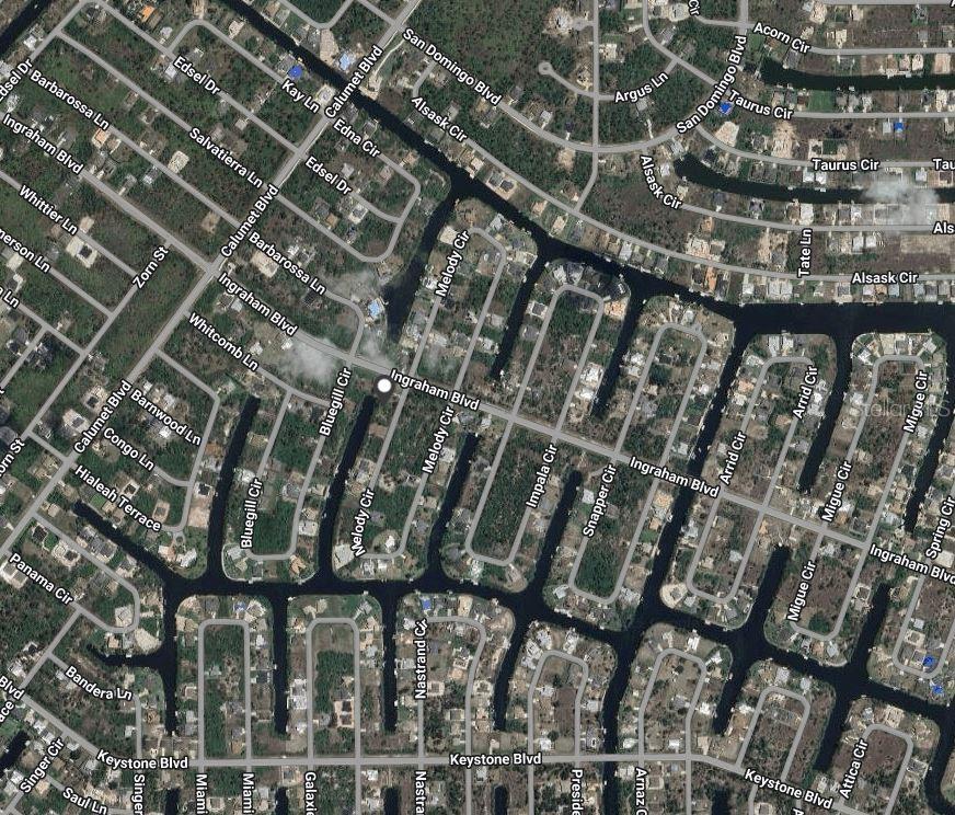 This is an aerial map view of a residential neighborhood with canals and streets — 9570 MELODY CIRCLE, PORT CHARLOTTE, FL