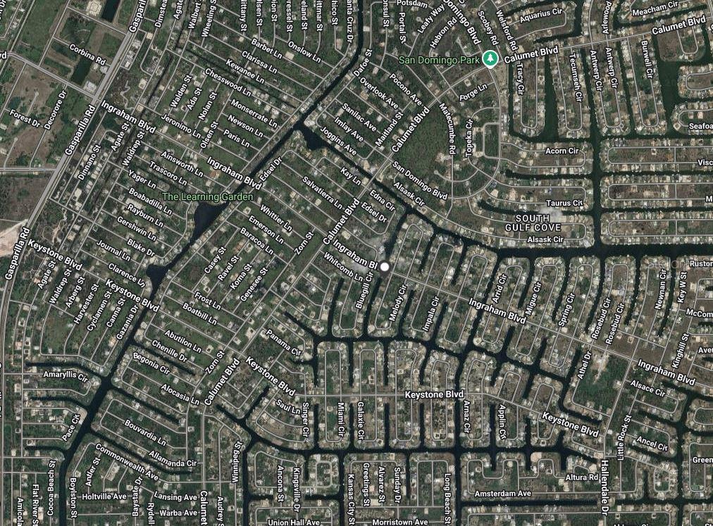 This is an aerial map view of a residential neighborhood with various streets and houses — 9570 MELODY CIRCLE, PORT CHARLOTTE, FL