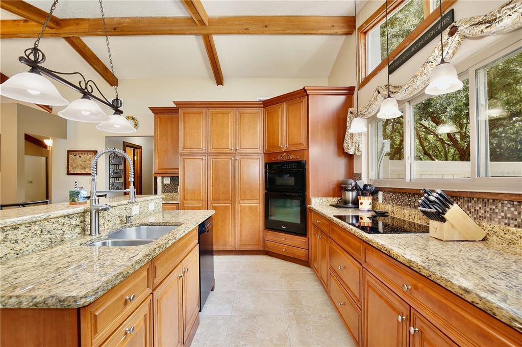 An entryway features a wooden door, tile flooring, a small cabinet, and a wall clock — 106 POLO LANE, SANFORD, FL